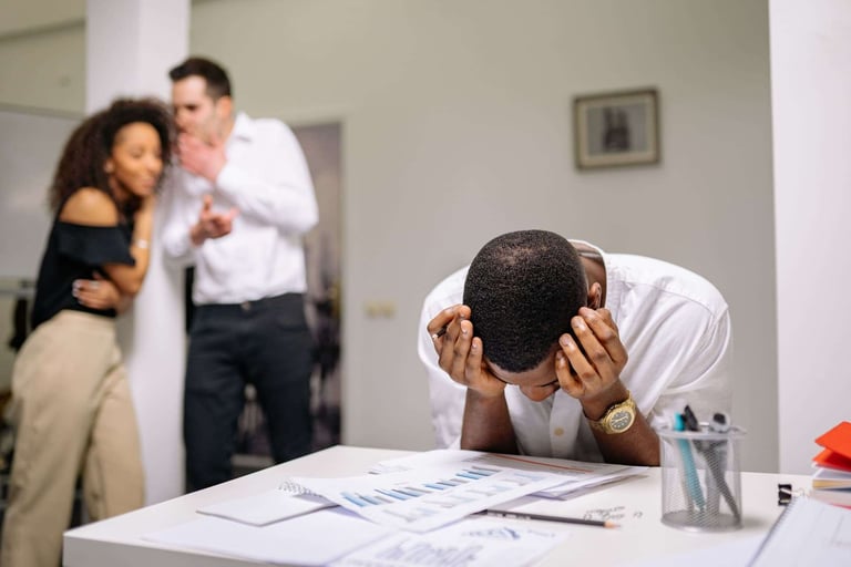 Man being harassed by two colleagues (1)
