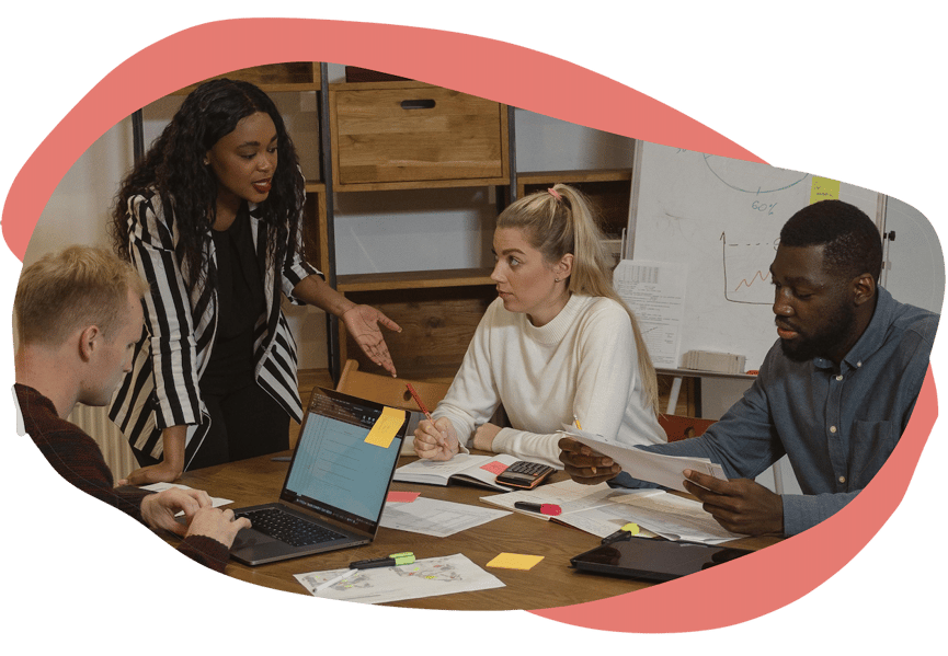 Team discussion around a shared worktable