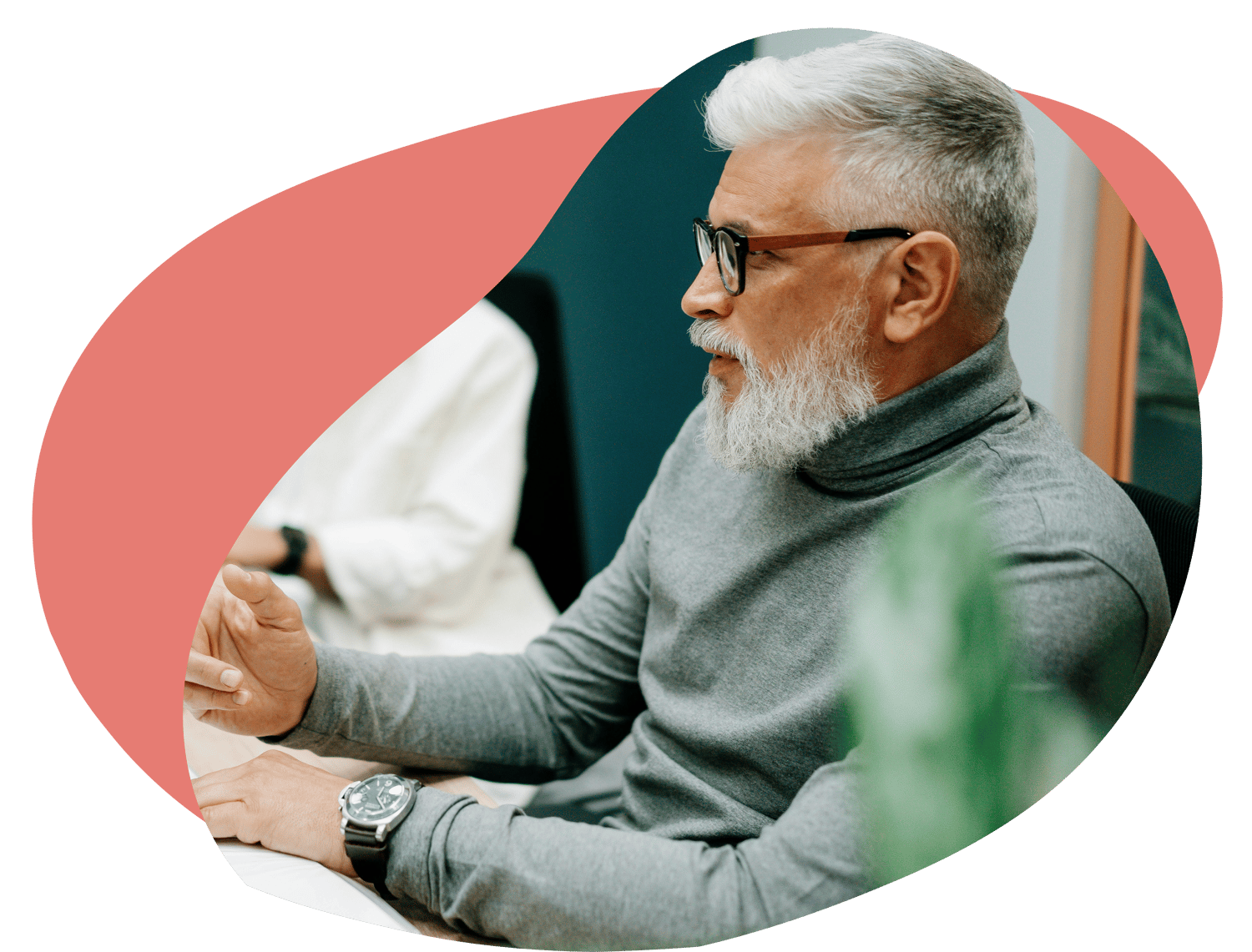 A professional taking part in a focused discussion during a workplace meeting.